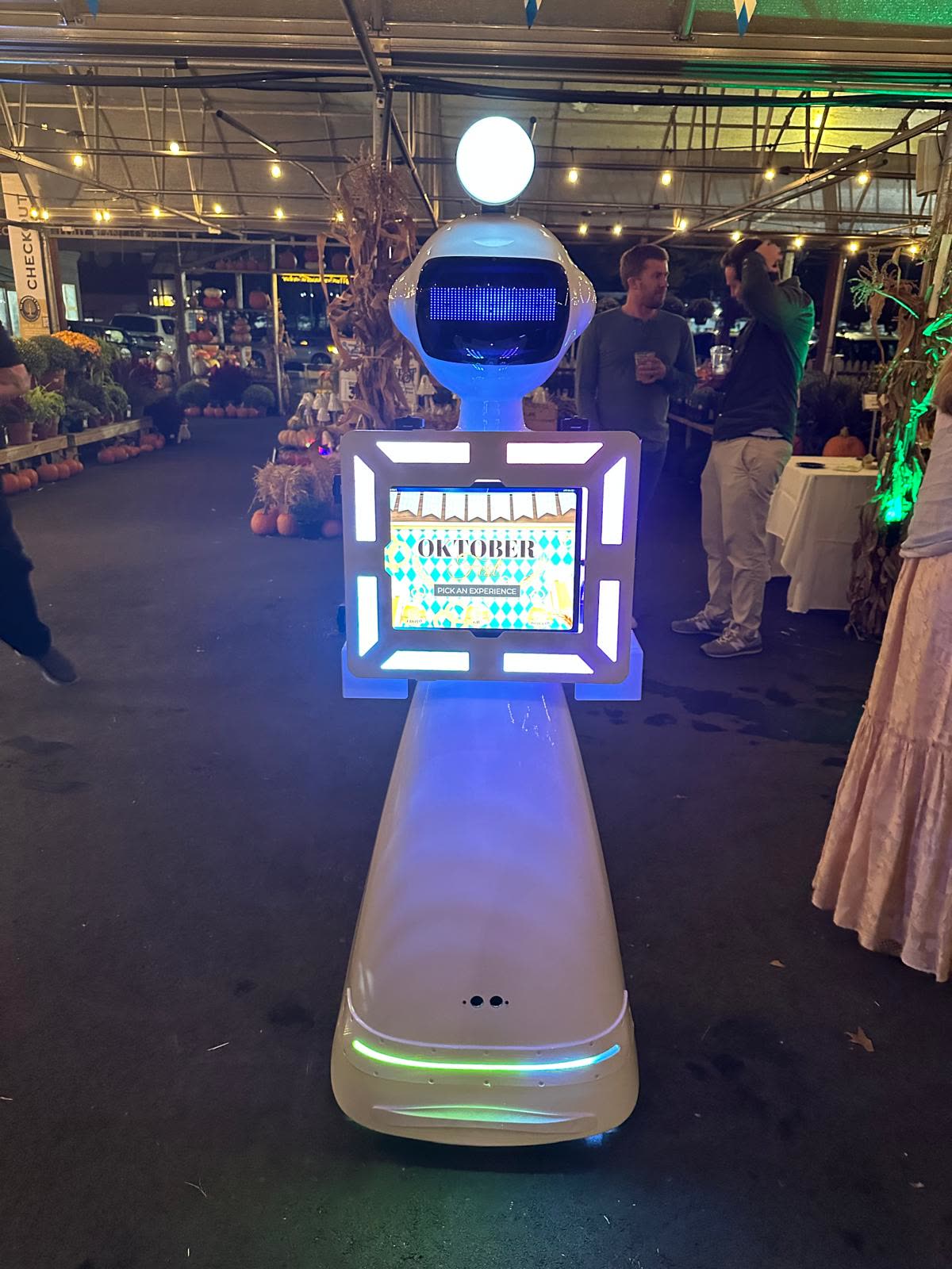 Guests having fun with the We Pose N' Snap robot photo booth