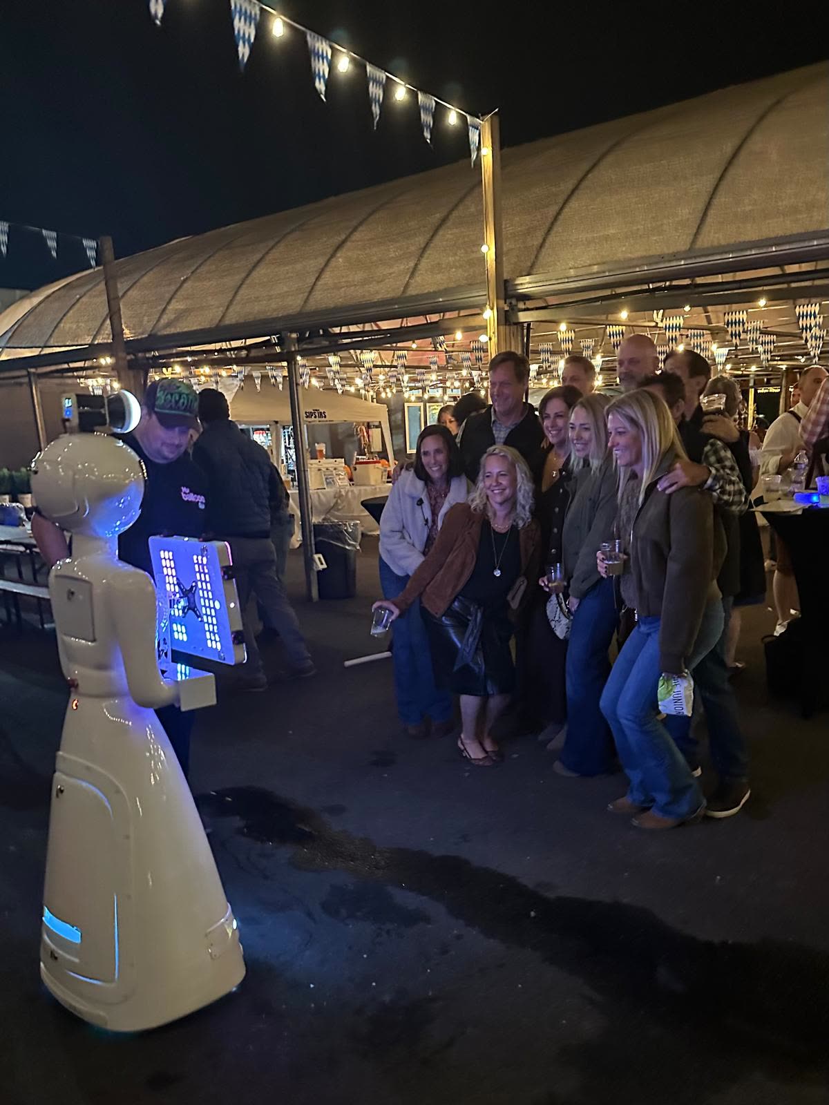 Guests having fun with the We Pose N' Snap robot photo booth