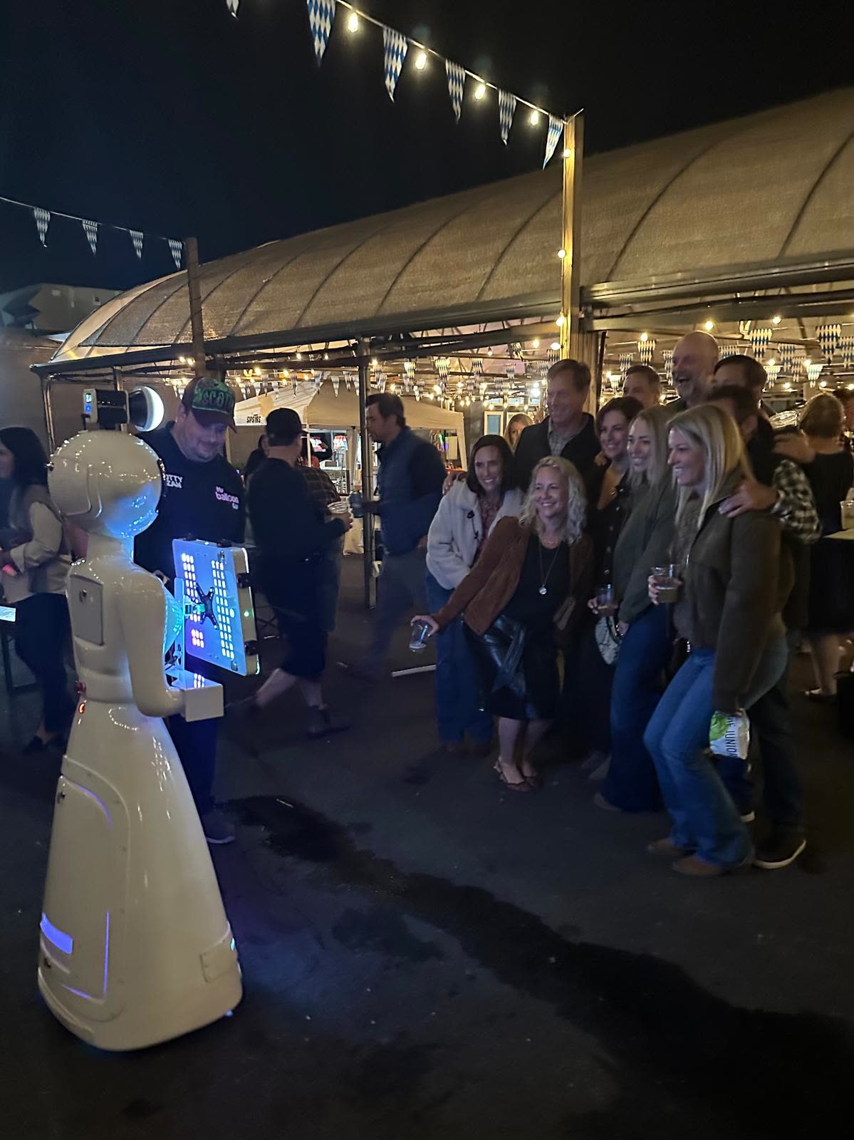 Guests having fun with the We Pose N' Snap robot photo booth